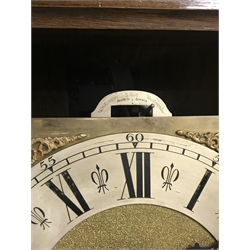  Early 20th century oak longcase clock, the case with astragal bevel glazed door and scrolling foliage carved decoration, triple brass weight driven chiming 'Gustav Becker' movement, with Wittington, silent and Westminster lever adjust, silvered chapter ring with Roman numerals, H204cm  