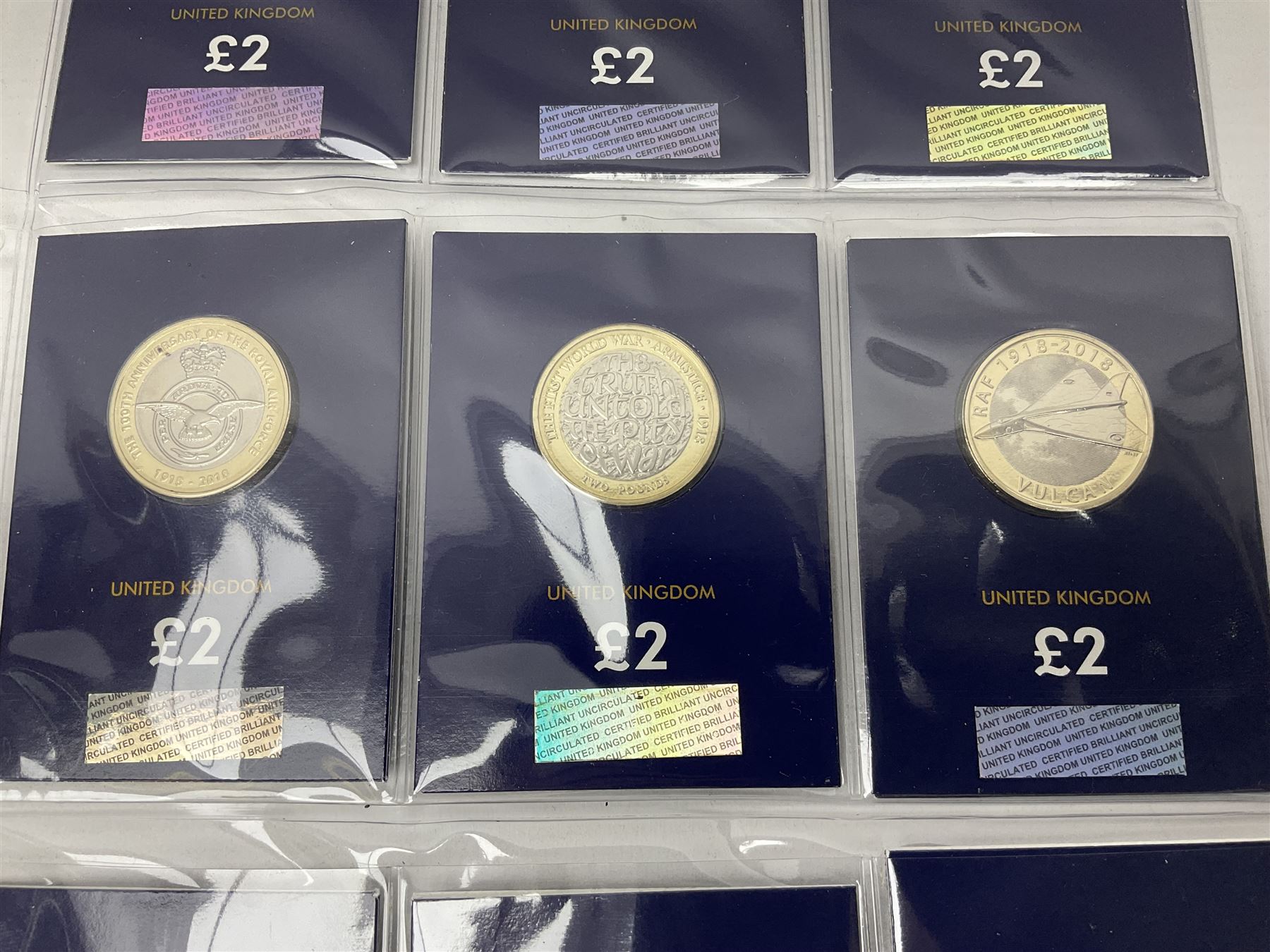 Mostly United Kingdom Queen Elizabeth II commemorative two pound  coins, including 2017 'Jane Austen', 2018 'Sea King', 2018 'Vulcan' etc face value of UK coins approximately 98 GBP