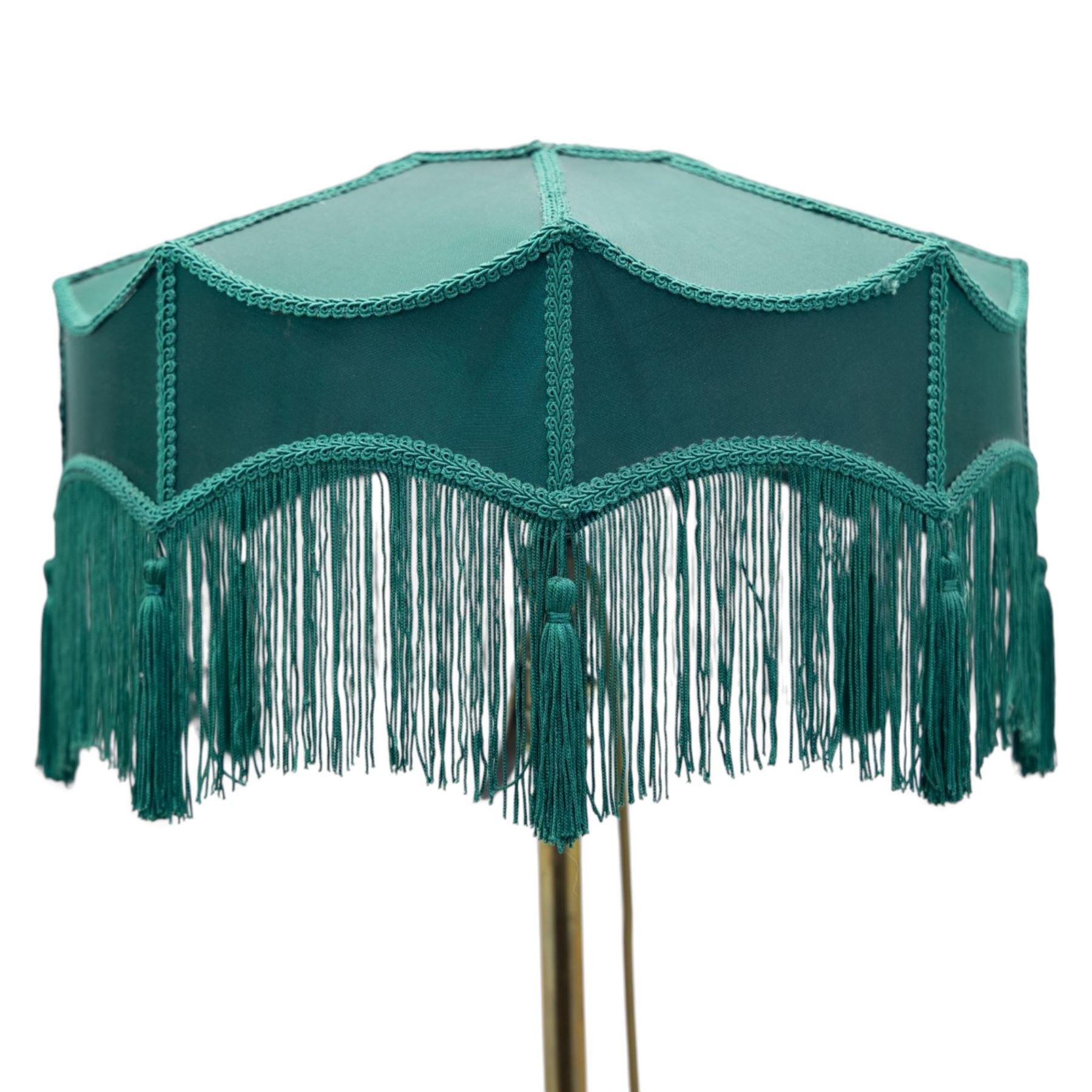 Art Deco brass standard lamp, telescopic column with level action, ring turned collars, raised on a shaped tri-form base with fluted pad feet, complete with green fabric fringed shade