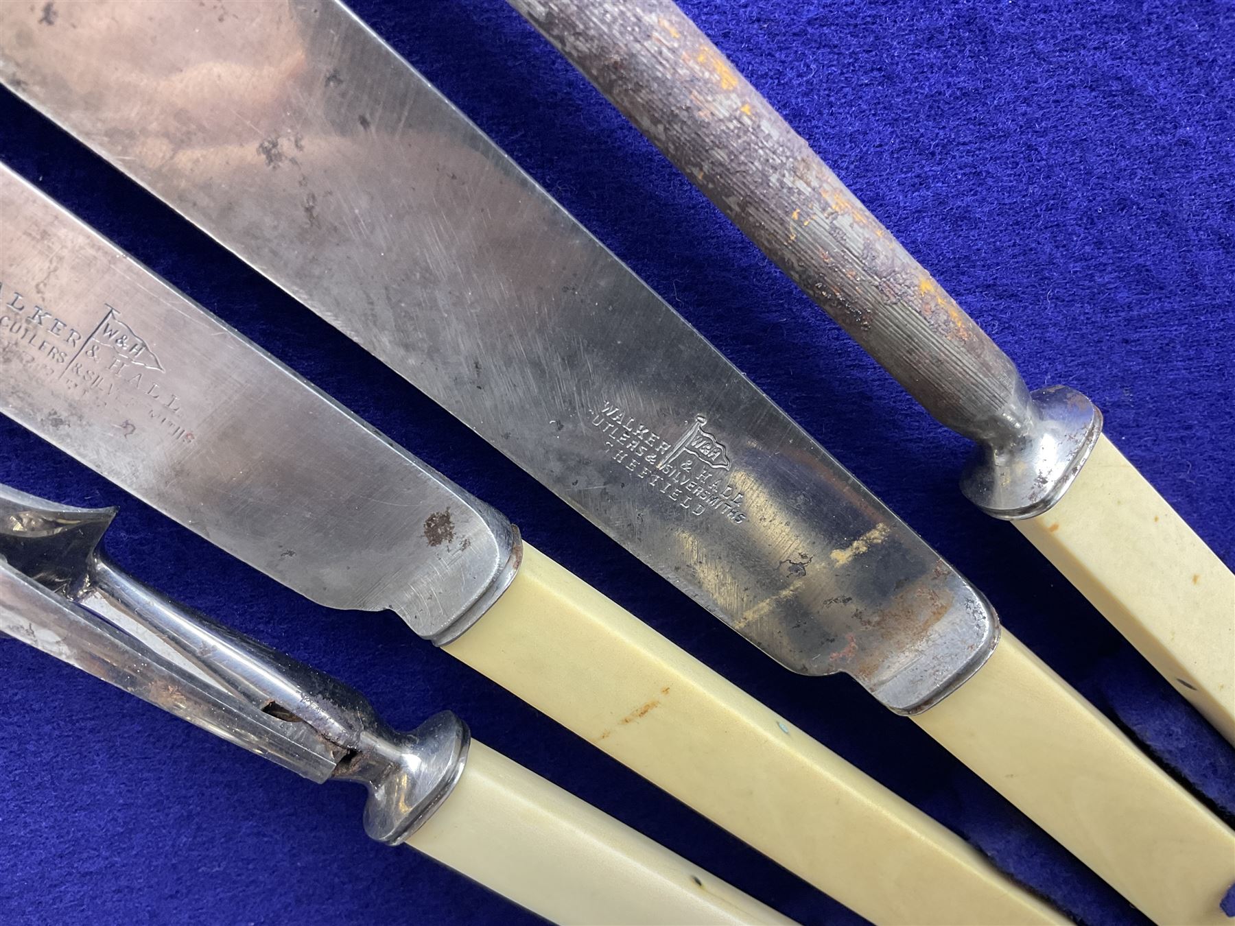 Walker & Hall silver-plate part canteen of cutlery, together with hallmarked silver cutlery comprising pair of Robert Pringle & Sons teaspoons, fork and butter knife, and silver handled knife and fork, cased set of Walker & Hall fish servers with simulated bone handles, and quantity of silver-plate and other cutlery