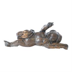 17th century carved figure of a putto, modelled with arms upstretched and head turned, app...