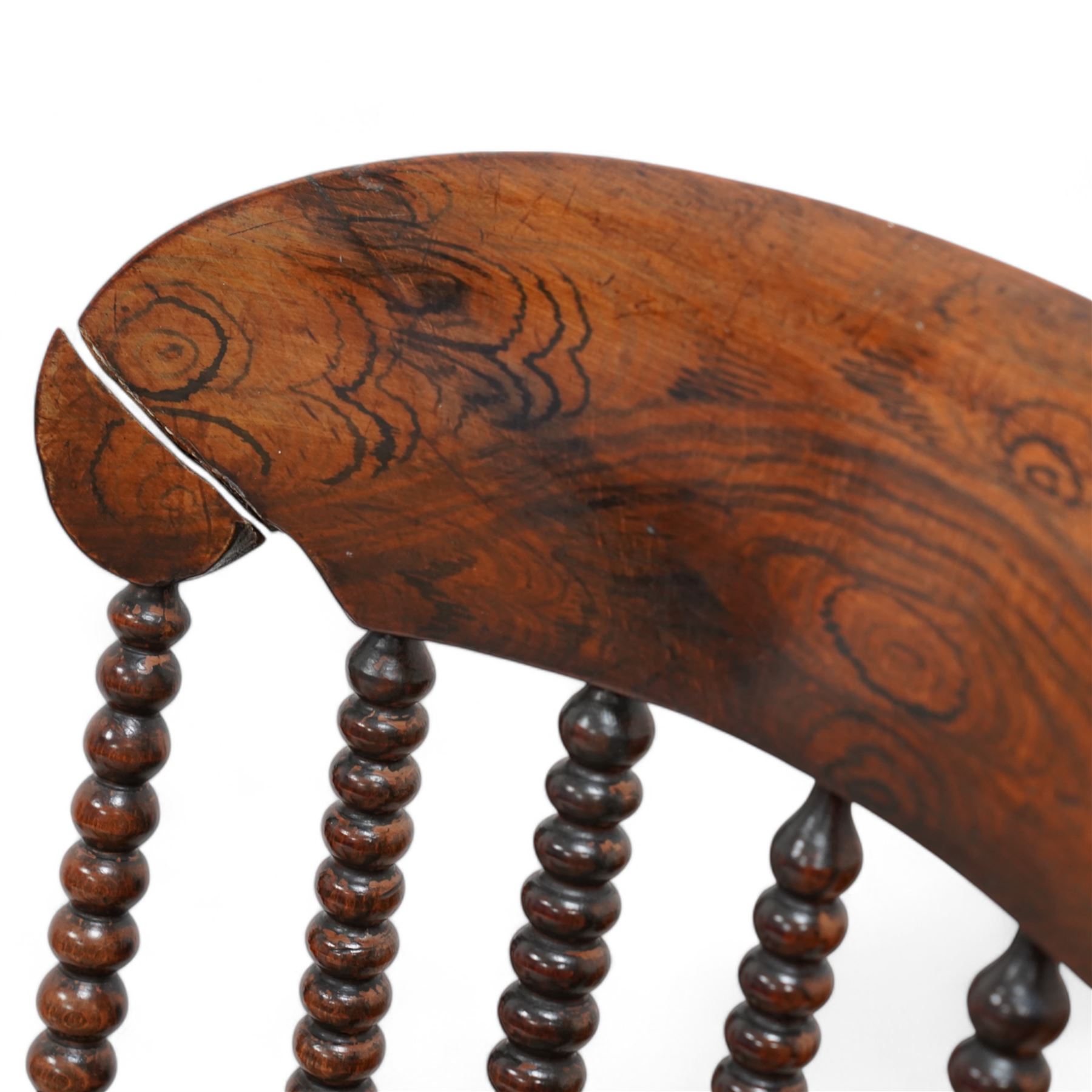 19th century simulated rosewood and stained beech framed armchair, shaped cresting rail over bobbin turned rails, on bobbin tuned supports united by stretchers 