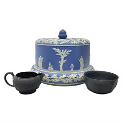19th century Wedgwood black basalt jug and dish, together with a Jasperware cheese dome and cover, decorated with a band of figures within foliate bands, the cover with acorn finial, cheese dome H20cm