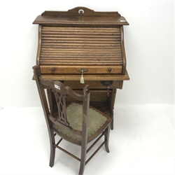  Early 20th Century tambour roll top desk enclosing fitted interior above single drawer, shaped solid end supports (W70cm, H110cm, D47cm) and an Edwardian chair (2)  