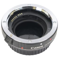Collection of Canon camera lenses and accessories, including EF 50m 1:1.4 lens, EF 35mm 1:2 lensFD 28mm 1:2.8 lens, FD 50mm 1:1.8 lens, FD 135mm 1:2.5 S.C lens, FD35-70mm 1:3.5-4.5 lens, three Speedlite 550EX flashes, Transistor pack E, lens hoods, battery chargers, etc 