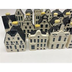 Twenty seven KLM Bols Blue Delft's decanters in the form of Dutch houses, some with contents
