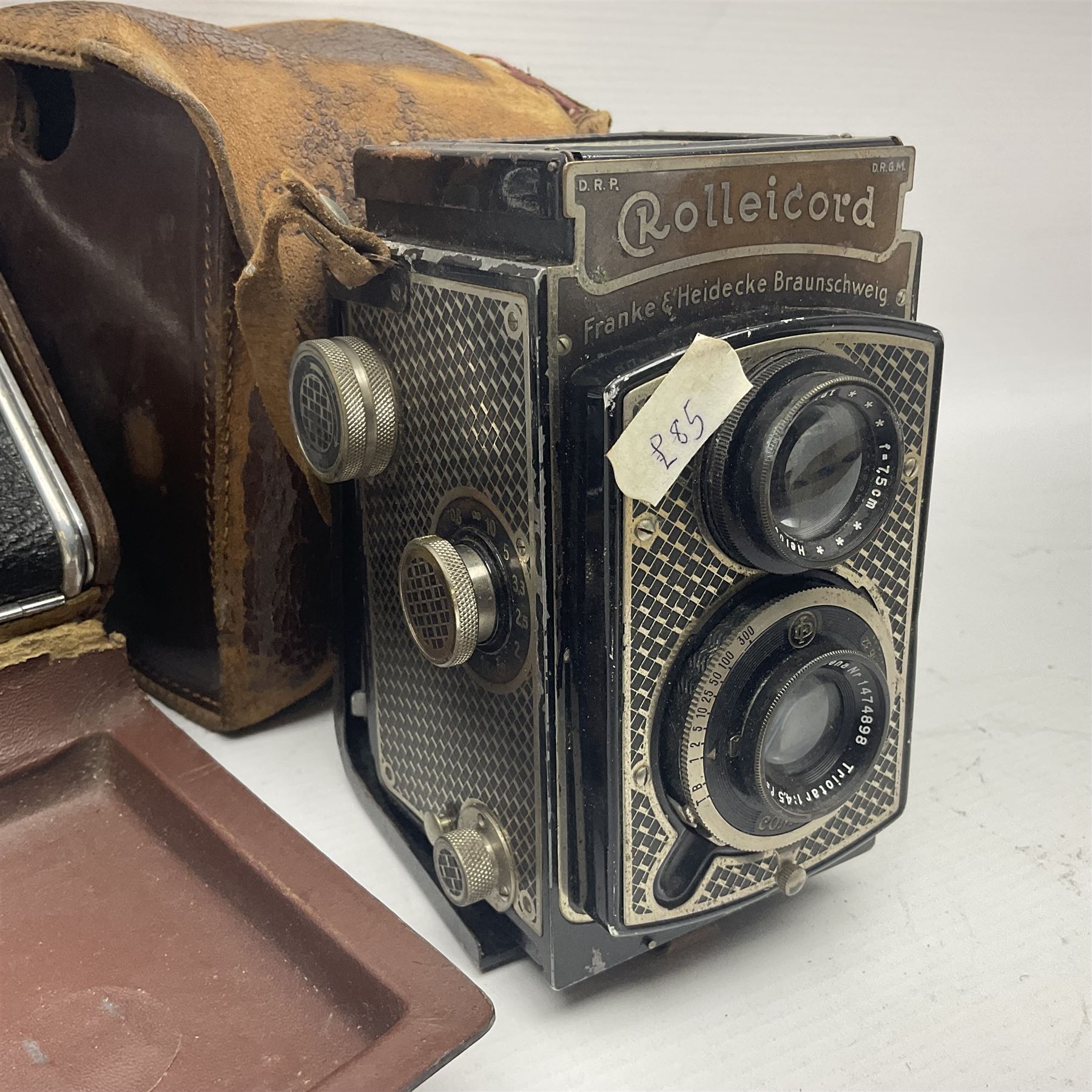 Franke & Heidecke Rolleicord twin lens camera, serial number 012706 with Heidoscop-Anastigmat f=7.5cm' lens and a 'Carl Zeiss Jena Triotar 1:4.5 f=7.5cm' lens, serial no 1474898, together with three similar cameras, including SEM TLR, serial no 420218, Ising Pucky box and Ferrania Elioflex, three in leather carry cases