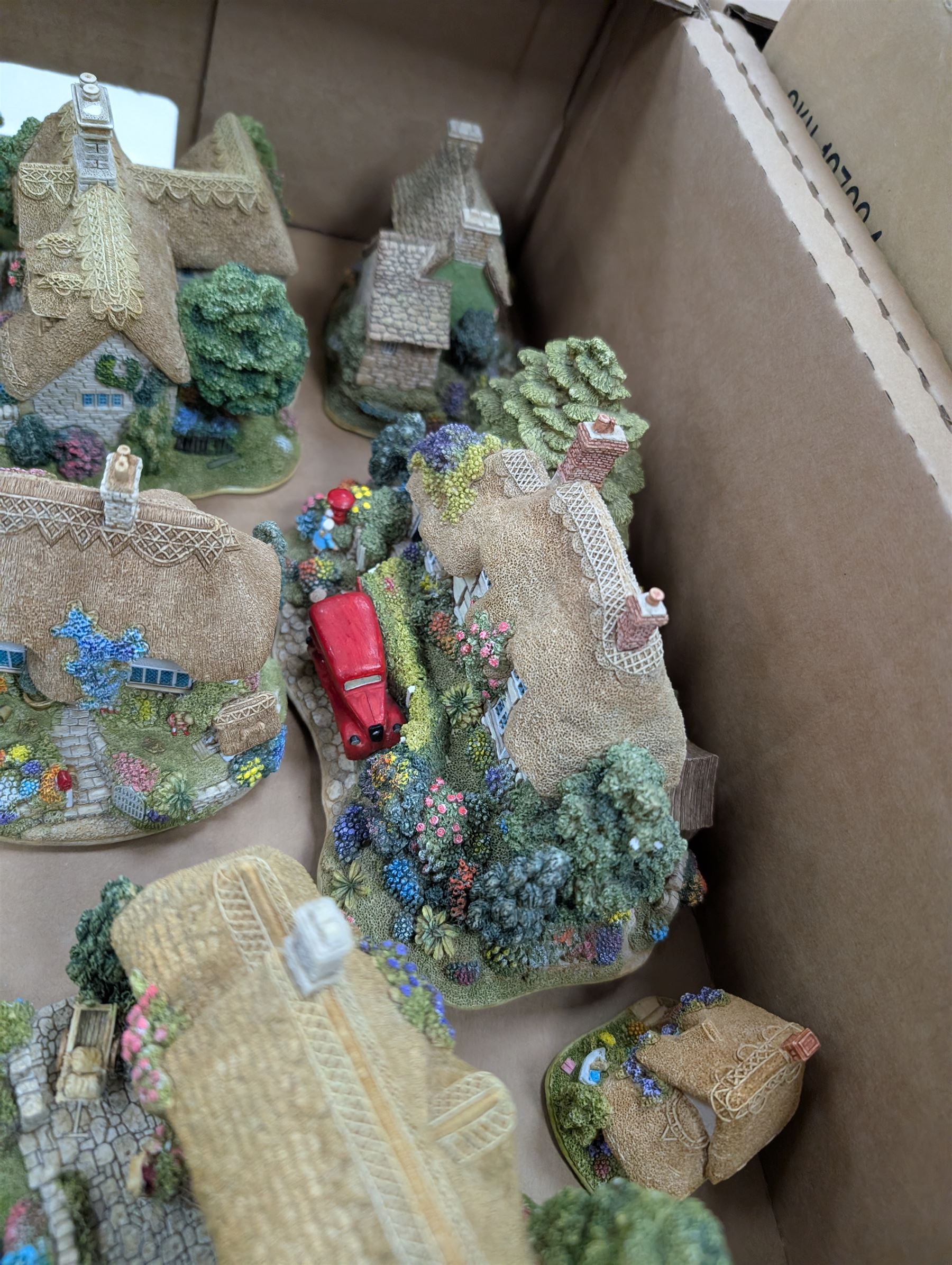 Six Lilliput Lane models, including The Old Mill at Dunster and Pen Pals, together with two Memory Lane models and two Lakeland Studios plaques, most with boxes