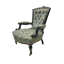 Victorian Aesthetic Movement ebonised and parcel-gilt armchair, carved and fluted with Greek key decoration, upholstered in blue and ivory foliate patterned damask fabric with sprung seat, scrolled arm terminals with applied acanthus leaf decoration, tapering fluted supports with ceramic castors