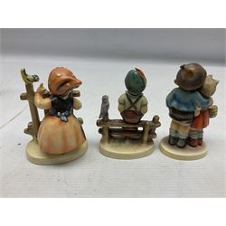 Seven Goebel Hummel figures, comprising Chimney Sweep 12/I, Apple Tree Girl 14/I, Apple Tree Boy,  Little Goat Herder 200/I, Surprise 94 3/0, Signs of Spring 203/20 and Wayside Harmony 111/30, tallest H15cm