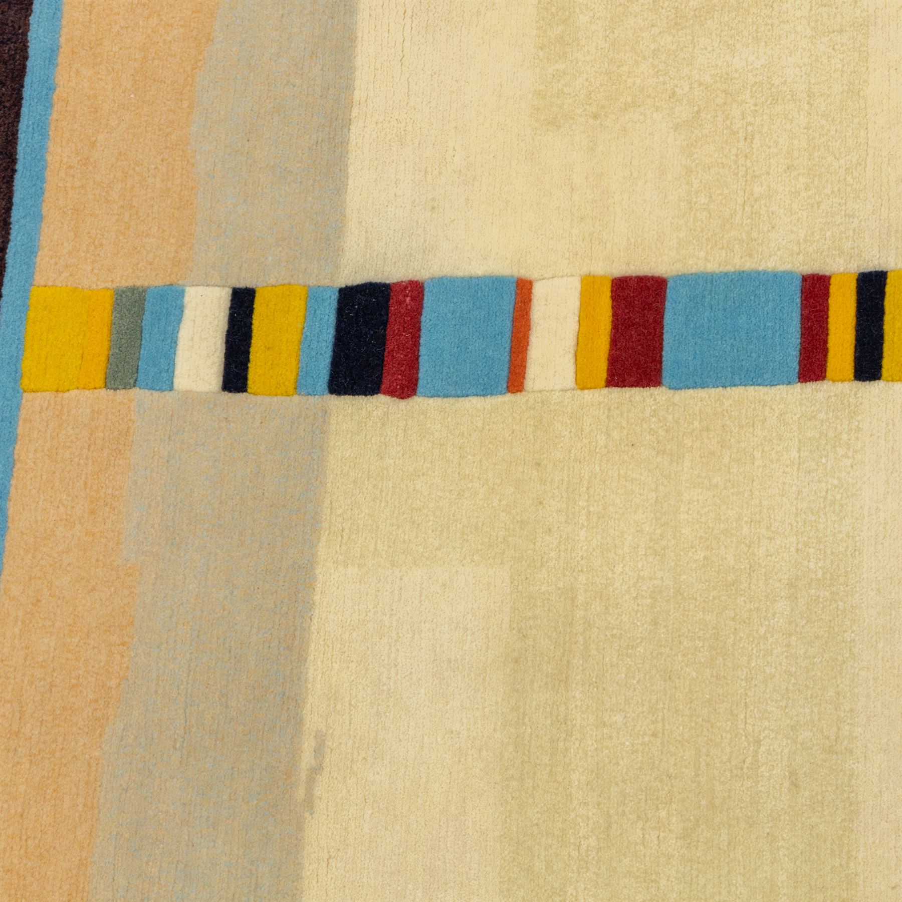 Rugs by Design - ‘Sand Bar’ Nepalese thick pile wool rug, with abstract horizontal bands in cream, blue, camel and dark brown tones, centred by a narrow multicoloured vertical stripe
