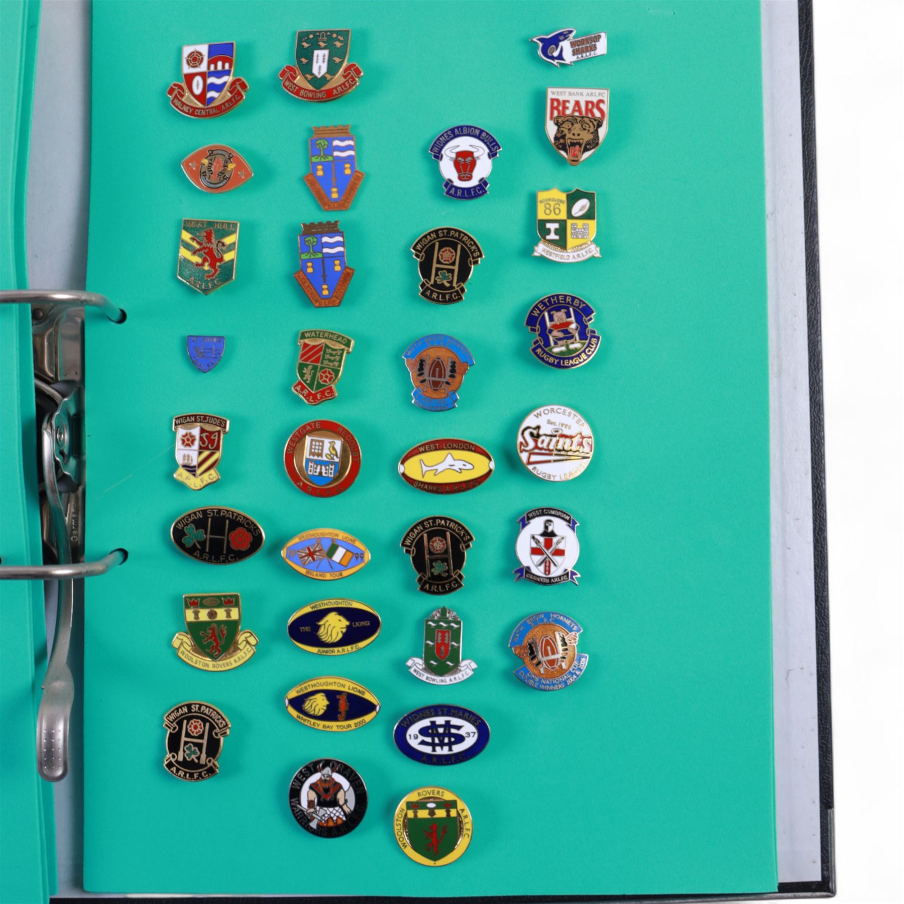 Amateur rugby league enamel badge collection, teams including Birmingham Bulldogs, Bridlington, Dudley Hill, Duke of York, Edinburgh Eagles, Guiseley, Rangers, Huntingdon, Keighley Town, Leigh Miners, Pilkington Recs, St Josephs, Thornhill Trojans, West London Sharks etc, all displayed in three folders and six amateur league badges from Leeds & District, Hull & District, York & District, Warrington, Lancashire County and Yorks County in box display, (approximately 270)