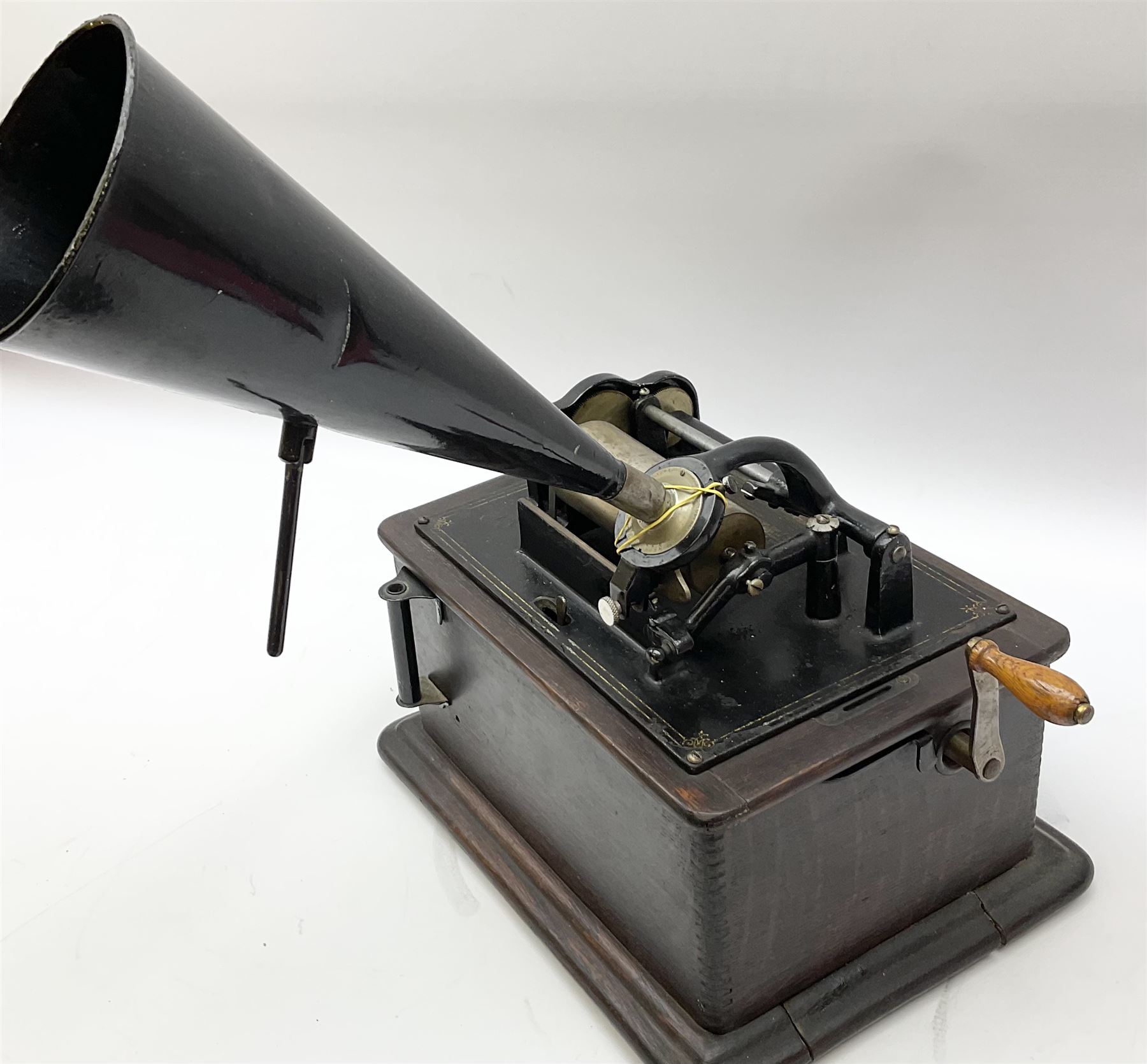 Edison Standard Phonograph with oak base (no cover), the reproducer marked 'Model C', serial no. 634857, last patent date Oct.1905, with black japanned conical horn L33cm; together with five cylinders