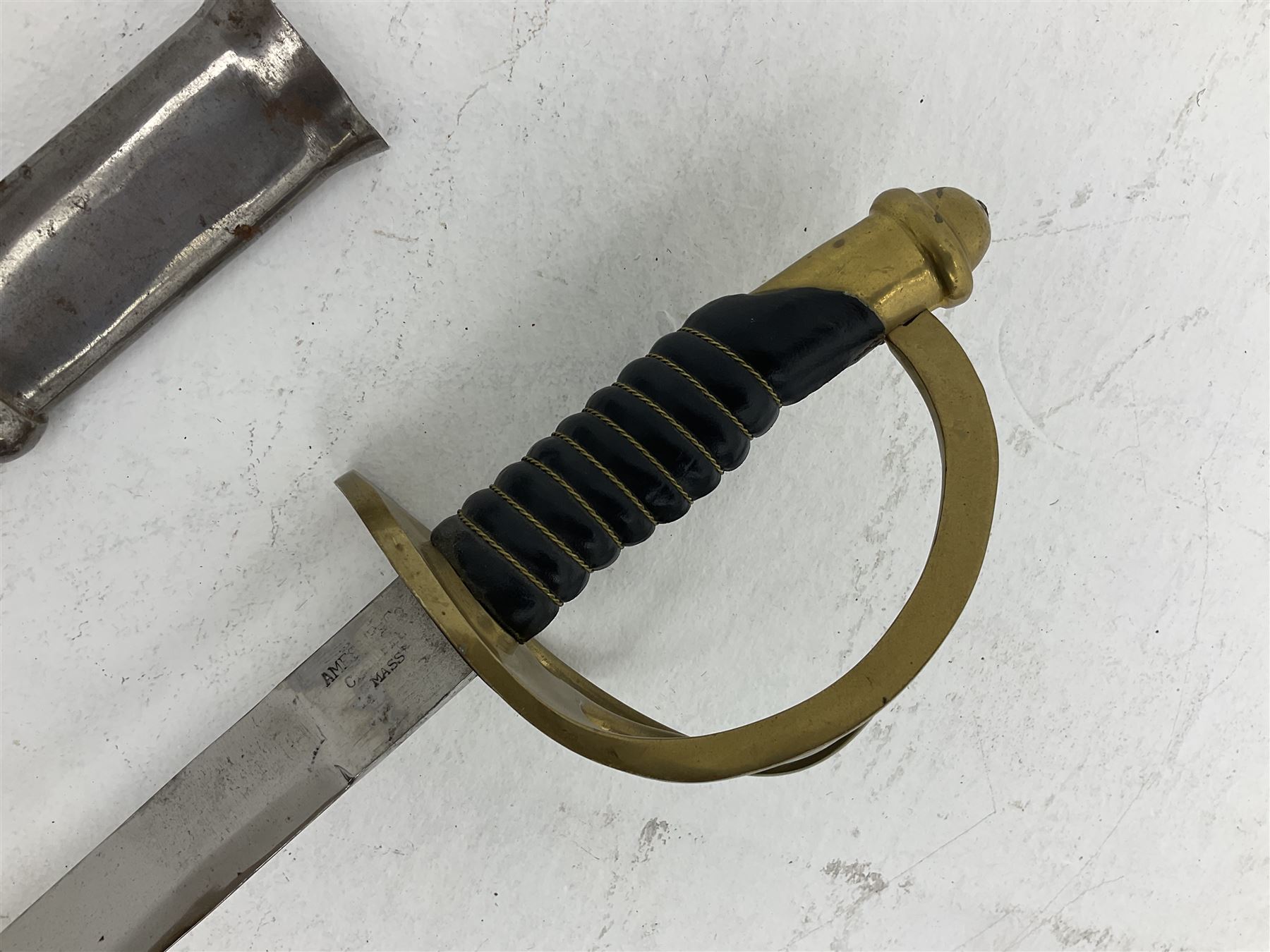 Reproduction American Civil War Cavalry trooper's sword, the 88cm slightly curving fullered steel blade marked to the ricasso 'Ames & Co Chicopee Mass.' and 'US ADK 1862'; brass hilt and leather covered grip; in steel scabbard L110cm overall;  and another reproduction sword (2)