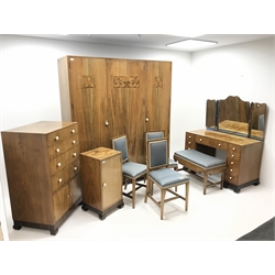  Art Deco walnut and marquetry bedroom suite by Gaylayde, comprising of an oak lined triple wardrobe, three doors enclosing fitted interior, shaped bracket supports (W171cm, H195cm, D56cm) a bedside cabinet, single door (W40cm, H77cm, D40cm) a chest, four drawers above two cupboard doors (W71cm, H113cm, D53cm) a dressing table, three piece mirror back, eleven drawers (W119cm, H140cm, D57cm) with stool and three chairs (W43cm)  