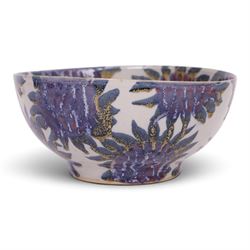 Sophie Hamilton (1963- ); Sunflower bowl, decorated with blue and purple sunflowers on a p...