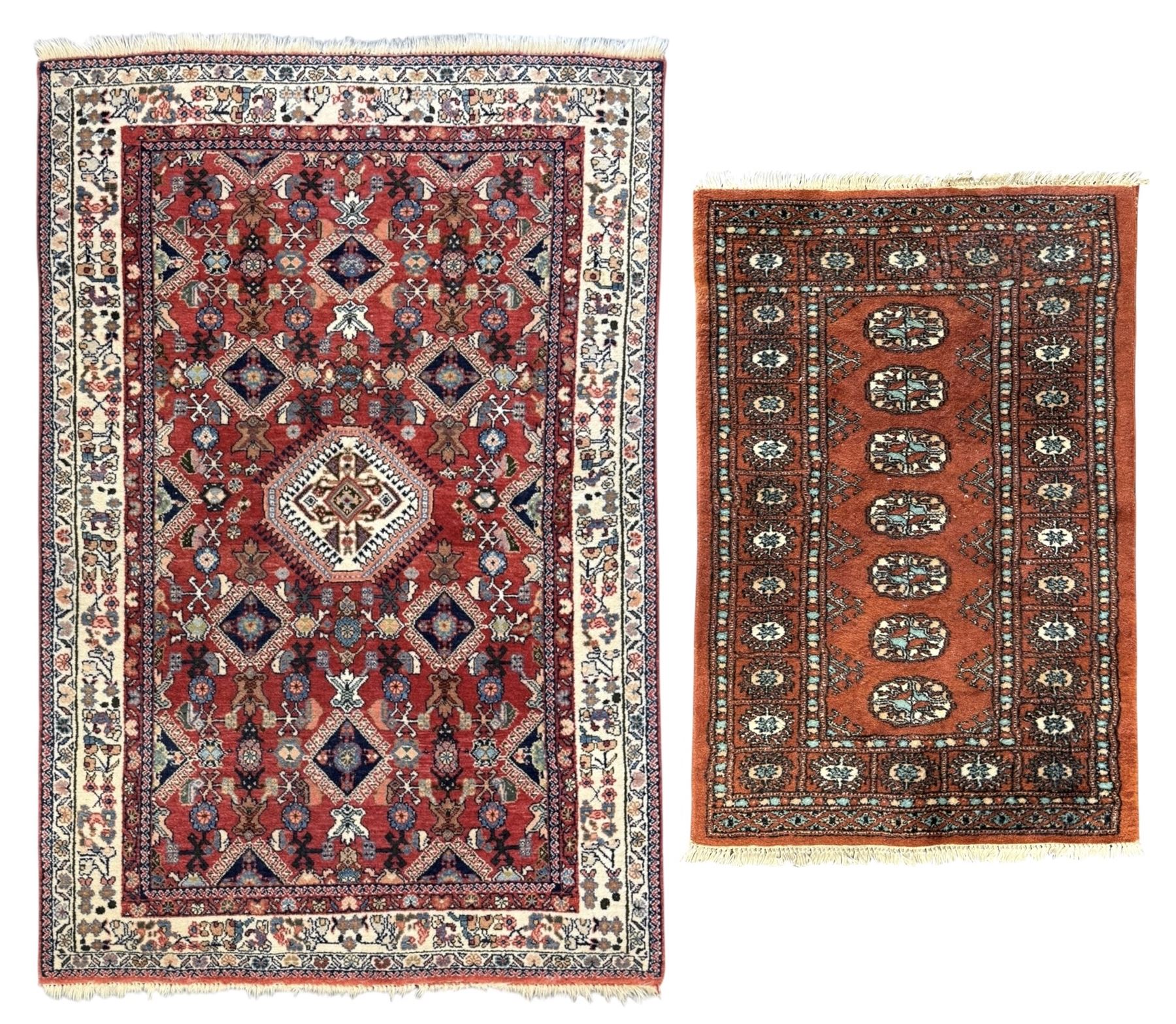 Pair of rugs one Persian hamadan rug central stepped medallion enclosing geometric motifs in ivory and brown, framed by a cream border with scrolling palmettes and fringed ends (H 156cm W 105cm), one Pakistani Bokhara rug rust red ground with repeated Tekke gul motifs within rosette and lozenged borders, fringed ends (H 98cm, W 65cm)