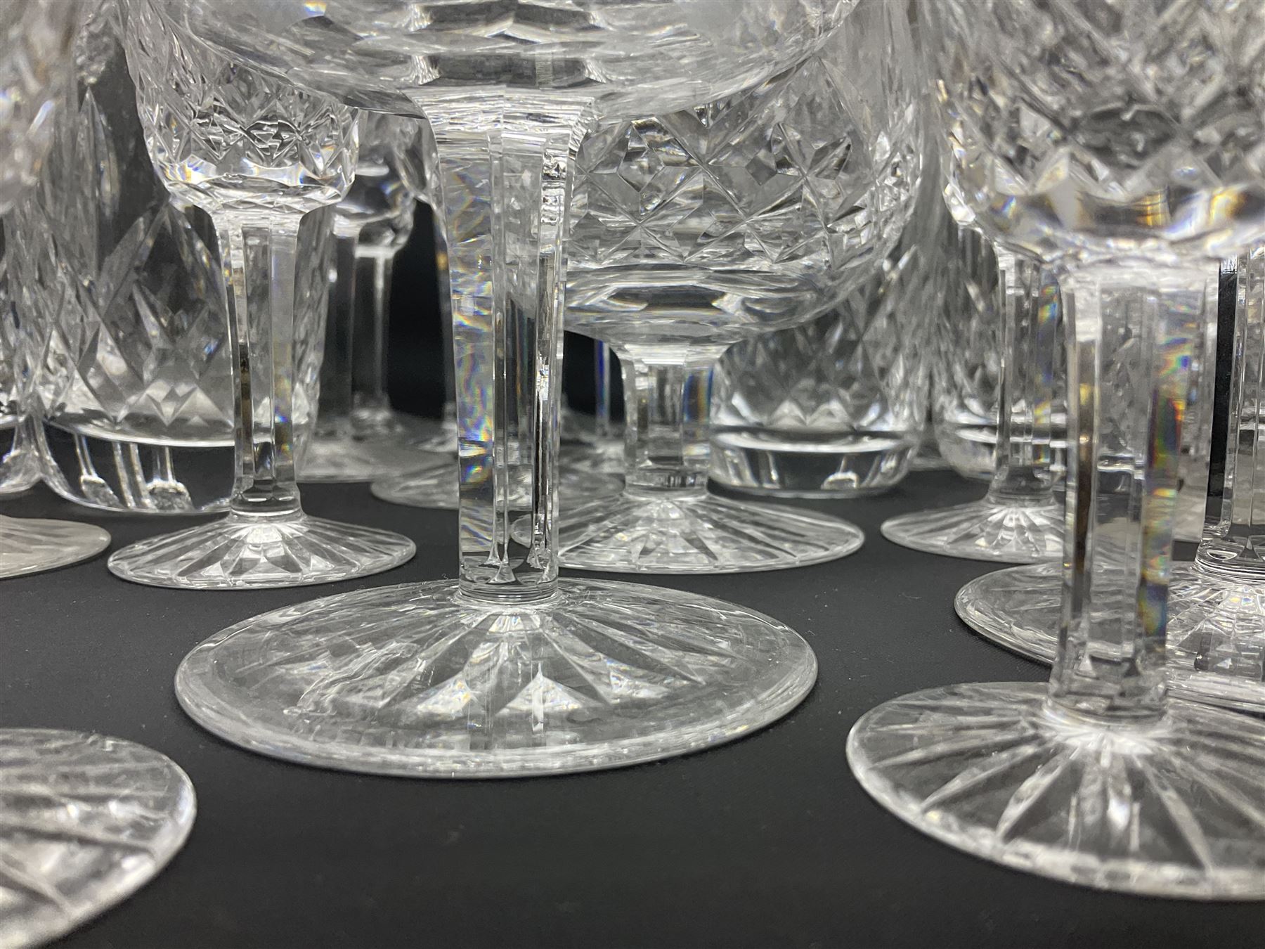 Set of Waterford Crystal Lismore pattern drinking glasses for six people, including hock glasses, goblets, champagne flutes,  sherry glasses, liqueur glasses, hi ball glasses, whisky glasses, brandy balloons, etc, all with etched maker's mark beneath  (62)