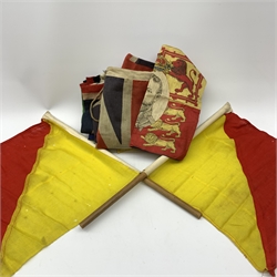 Thirty-seven various flags, pennants etc including Union flags, blue ensign, white ensign, Royal Standard, Scottish Rampant, Wales, Old Canada red ensign, Australia and New Zealand, France, Germany, South Africa (1928-94), semaphore and signal flags, 'God Save The King' banner, bunting flags etc