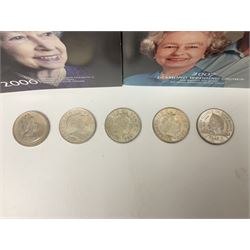 Seven Queen Elizabeth II United Kingdom five pound coins, including 2006 and 2007 in card folders, etc. 