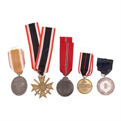 WWII Third Reich medals, comprising Eastern Front medal, Police 8 year long service medal, Western wall medal, War merit cross 2nd class with swords and War merit medal 