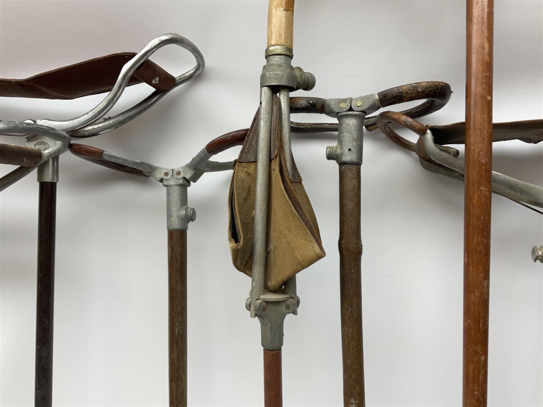 Adjustable Gamebird shooting stick, together with Mills Munitions shooting stick, Featherwate shooting stick, five others and two wooden walking sticks.  