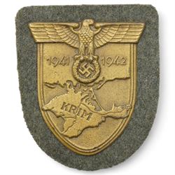 German Third Reich Krim shield arm badge 1941-1942, Auxiliary Cruiser badge and a WWI first class Iron Cross with field conversion (3) 