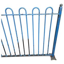 Two sections of painted iron garden or estate boundary railing, comprising a 19th century wrought iron section with graduated spearhead uprights, together with a later hoop-top section with ball-finial end posts, both in blue painted finish