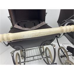 Pair of 1980s Silver Cross brown coach built dolls prams; each with folding canopy and apron, tubular framework with suspension, spoked wheels with brake and luggage rack and separate matching shopping bag L93cm