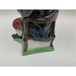 Early 20th century Staffordshire William Kent Squire toby jug, modelled seated upon a corner chair holding a jug of ale in his right hand, H28cm