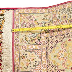 Late 20th-century Persian panel design silk and cotton blend rug, in pale tones of ivory, pistachio, green, crimson, pale blue, and rose, each compartment enclosing a stylized mihrab, boteh, cypress, and floral motifs, framed by a narrow floral border with guard stripes and cotton fringe ends 