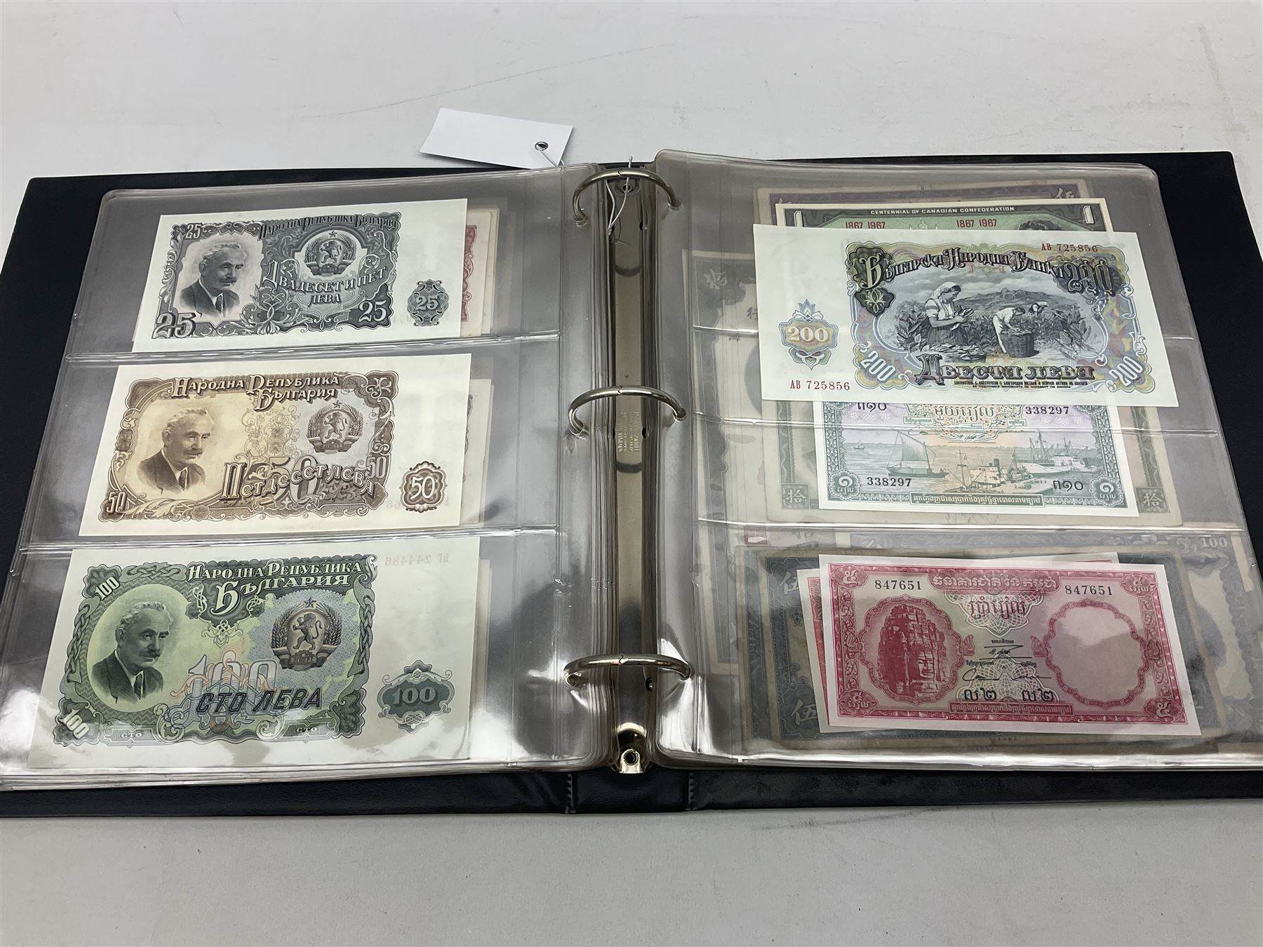 World banknotes, including Queen Elizabeth II The States of Jersey one pound 'DB202703', five pounds 'BB527762' and ten pounds 'AB651481', reserve bank of New Zealand two dollars '1L3 741894', King George V Straits Settlements one dollar 1st January 1935 'F/83 28924', various Bank of England notes etc, housed in two ring binder albums
