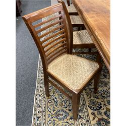 Large teak dining table, moulded rectangular top, on cabriole supports, together with a set of ten ladder back dining chairs with cane work seats