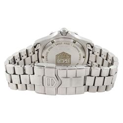 Tag Heuer gentleman's stainless steel quartz wristwatch, Ref. WK1112-0, silvered dial with baton hour markers and date aperture, on original stainless steel bracelet, with fold-over clasp