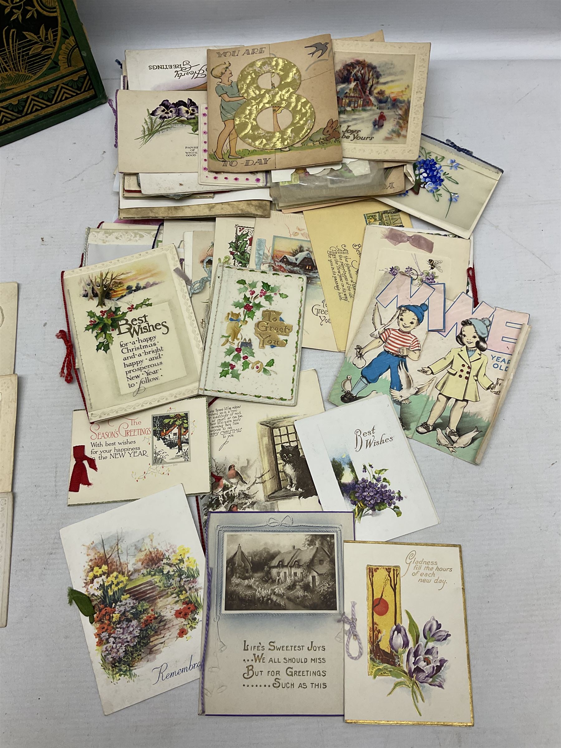 Victorian scrap album, well stocked with greeting cards and scraps; ten WW1 French embroidered silk postcards/greeting card including envelope type with greeting card insets; and large quantity of Edwardian and later postcards and greeting cards including maritime, Bonzo, greeting etc