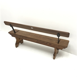 H Addison & Co Wellington Salop pitch pine and wrought metal reversible bench, W138cm