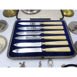 Set of six 20th century fruit knives with ivorine handles and hallmarked silver ferrules, within a silk and velvet lined case together with a quantity of metal ware including candlesticks, two pewter christening mugs, two vases, chamberstick and a collection of souvenir spoons etc 