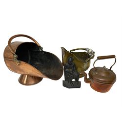 Copper coal scuttle, together with a brass example with lion masks and ceramic handles, iron doorstop, kettle, and framed silhouette picture
