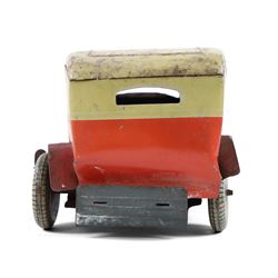 Mettoy tinplate clockwork Citroen saloon car, red orange body with cream roof and windows, with driver, Dunlop tyres and key, H9cm, L26cm