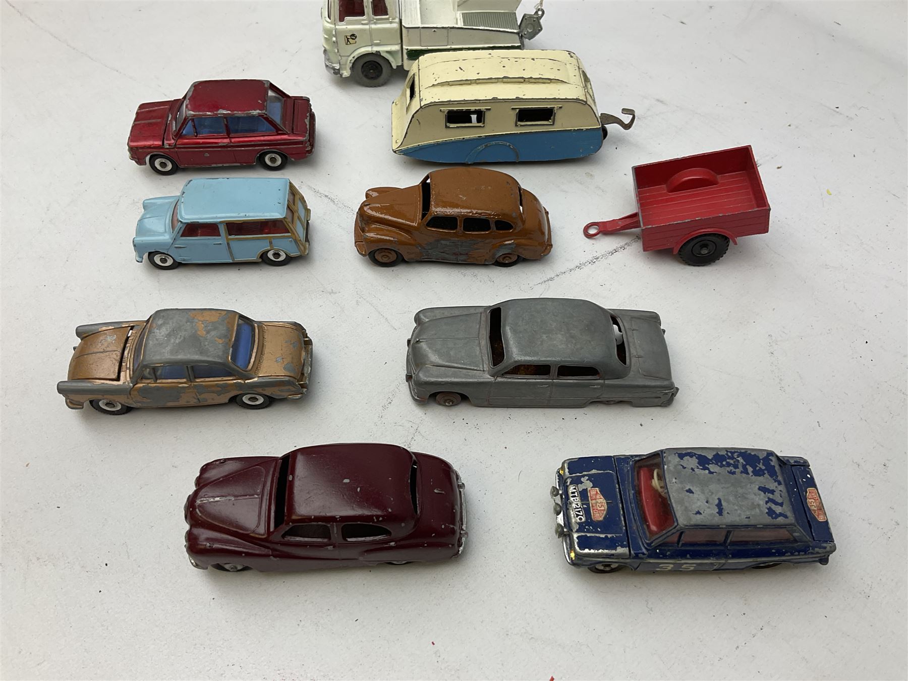 Dinky - twenty-five unboxed and playworn die-cast models including Lady Penelope FAB1, Caravan, Ford Sedan, Triumph TR2, Packard, Austin Somerset, Devon, Healey and Seven Countryman etc (25)