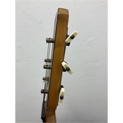 1950s acoustic guitar with f-holes and pickguard L105cm; black fur lined hard carrying case