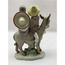 Lladro figure, A Ride in the Country, modelled as a young boy and girl riding upon a donkey, sculpted by José Puche, no 5354, year issued 1986, year retired 1994, H20cm