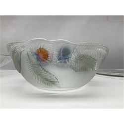 Two French pressed glass bowls of shallow circular form, relief moulded with flowers and foliage, together with a matching charger, largest bowl D34cm  