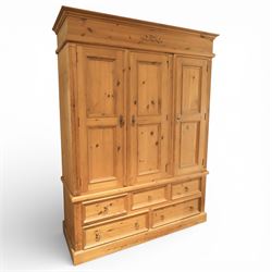 20th century pine wardrobe with drawer base, moulded cornice over three fielded panel cupb...