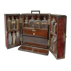 19th century mahogany travelling apothecary cabinet, with recessed brass carry handle to top, and two deep-section hinged doors to the front opening to reveal a fitted interior with clear glass bottles and two drawers, H27cm