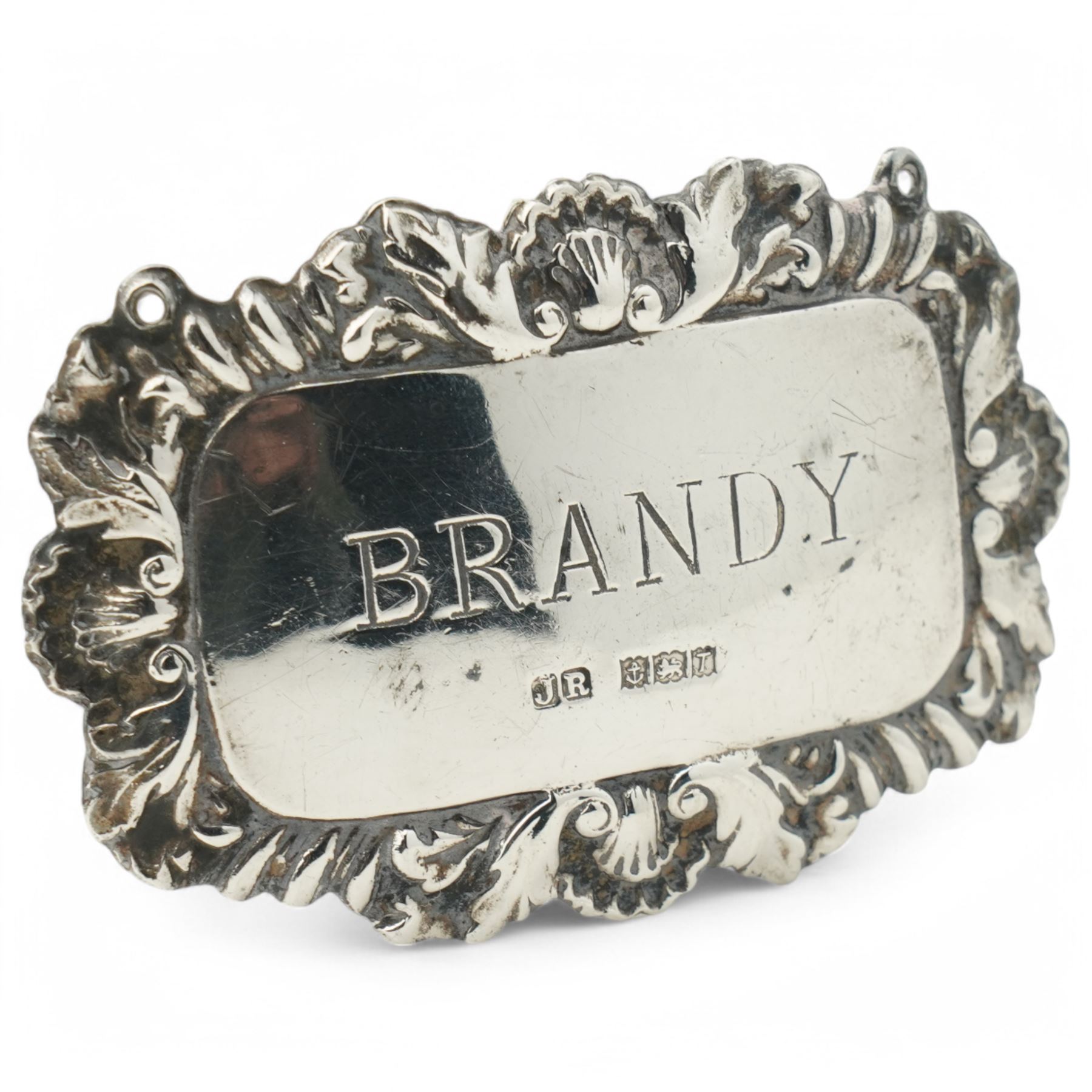 Spanish rectangular silver box, the hinged cover embossed with a hunting scene 9.5cm x 6cm 915 fineness mark and a silver decanter label 'Brandy'