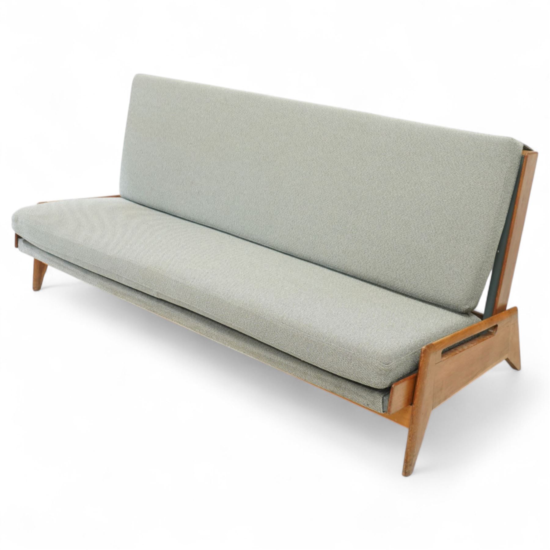 Gerard Guermonprez for Bobois - mid-century light teak sofa daybed, sides with angular teak wire sprung frame, integrated armrests with cut-out hand-holds, single fabric cushion back and seat, on out-swept tapered legs, circa 1955