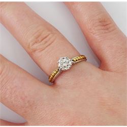 18ct white gold single stone diamond ring, with yellow gold bead design shoulders, London 1979, diamond approx 0.15 carat