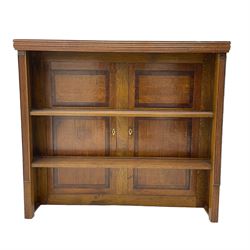 Early 19th century and later plate rack or bookcase, the back made from two early 19th century oak and mahogany press doors
