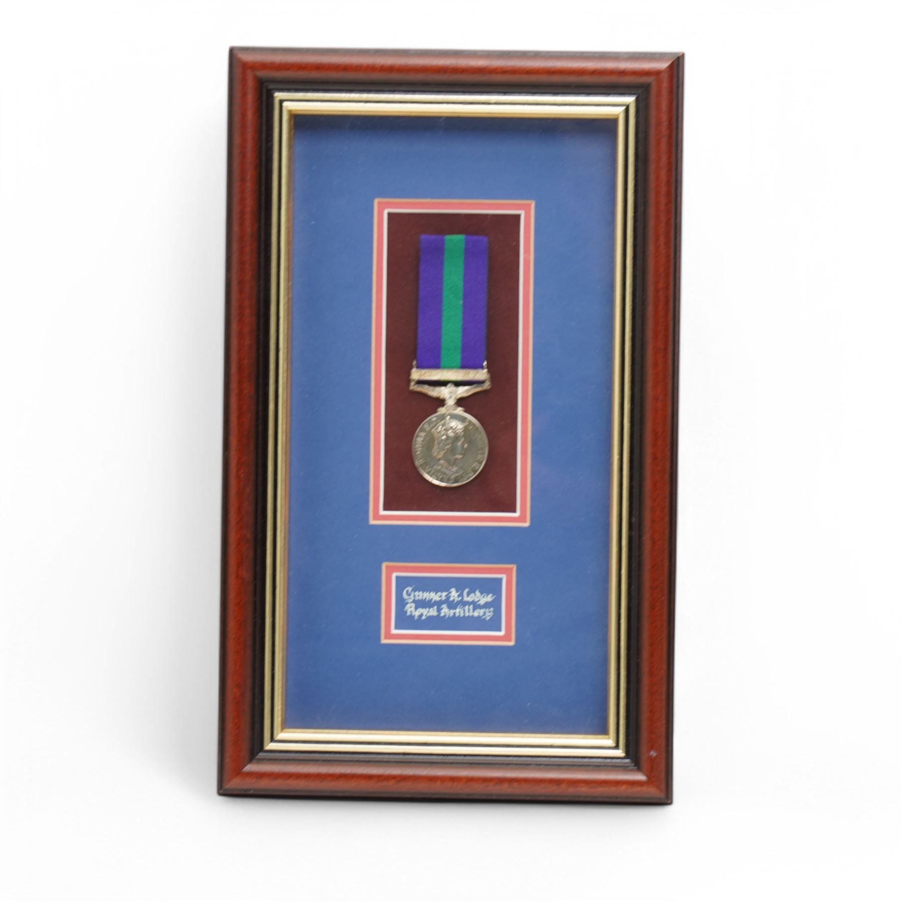 To: 22596749  Gunner A Lodge, Royal Artillery Elizabeth II General Service Medal with Canal Zone clasp, framed, the dress miniature, Royal Hong Kong Yacht Club badge, framed and a poster for M.C.C match against H.R.H. Yang di-Pertuan Besar's XI including Alan Lodge, framed